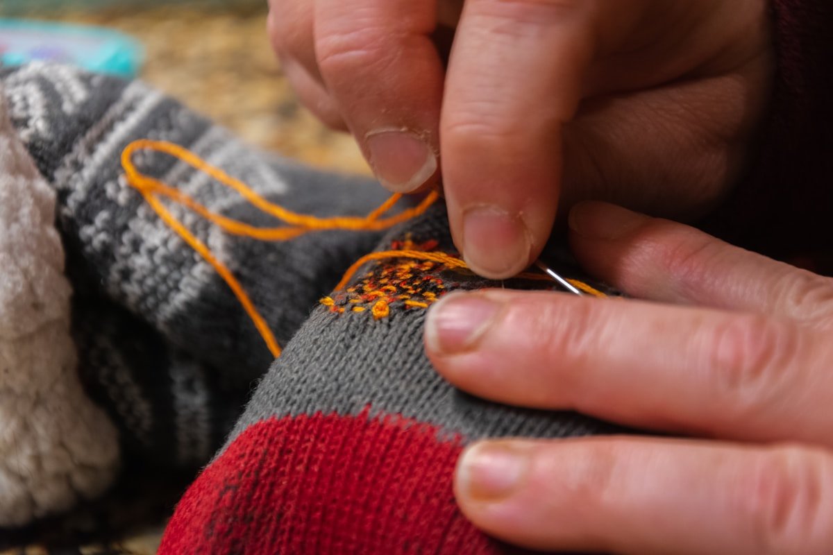 Sole grip motif derived from a brand logo shape on a grip sock reference